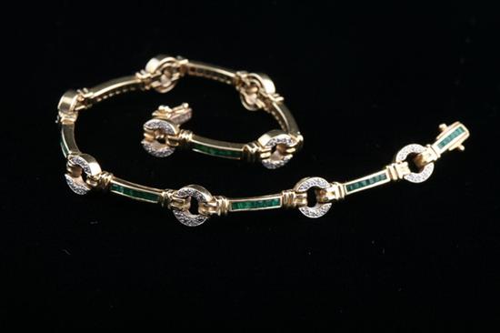 Appraisal: K EMERALD AND DIAMOND BRACELET Emerald channels alternate with diamond