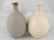 Appraisal: A pair of studio ceramic vases one white one oatmeal