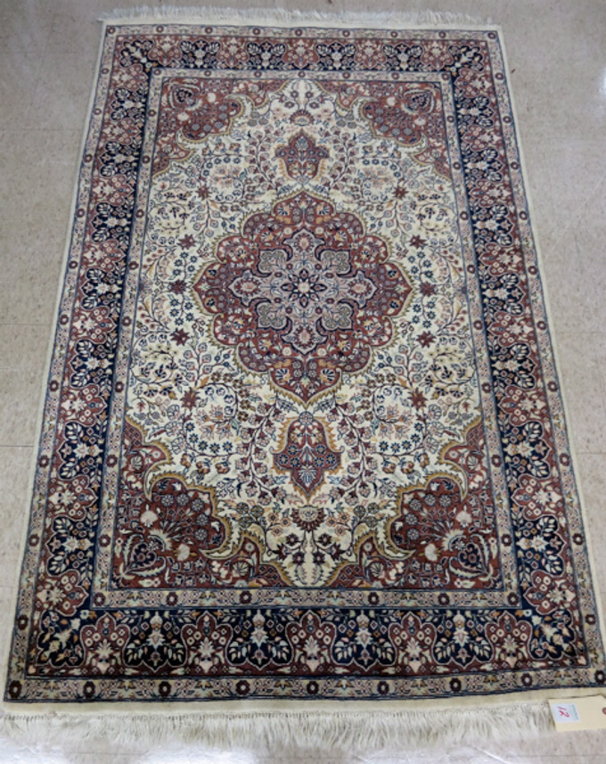 Appraisal: HAND KNOTTED ORIENTAL AREA RUG Pakistani Persian floral and central