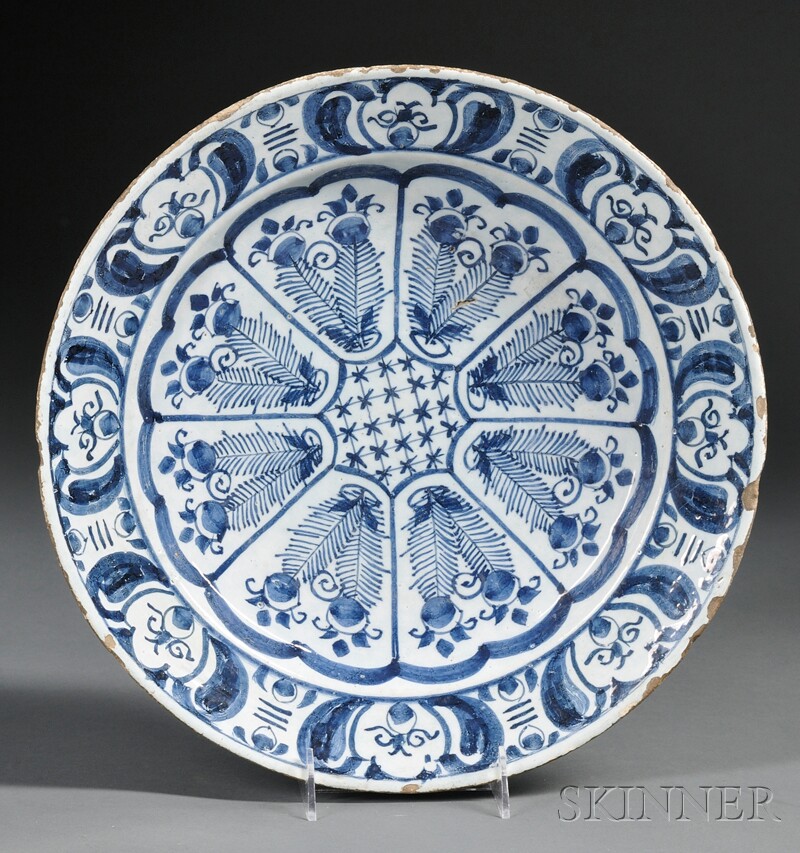 Appraisal: Delftware Charger th century centered with a floral medallion rim