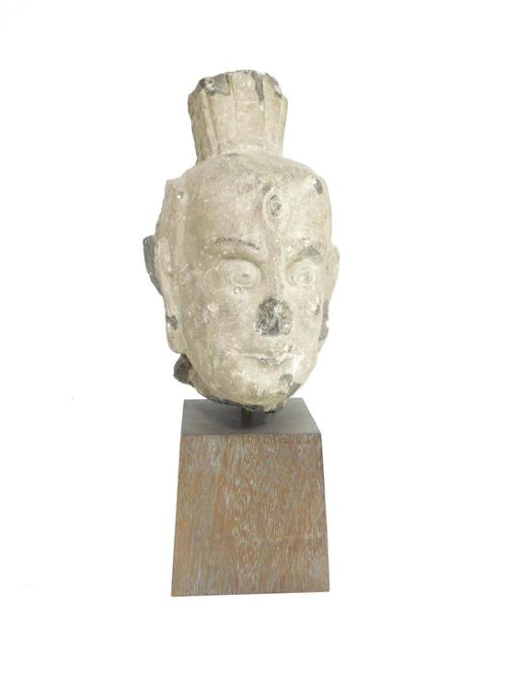 Appraisal: Carved stone head of a Lokapala Chinese Tang style mounted