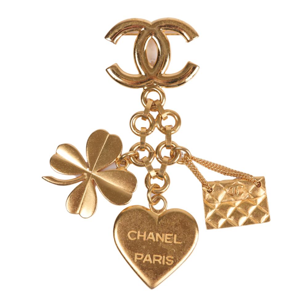 Appraisal: Vintage Chanel signed gold tone charm brooch A with Chanel