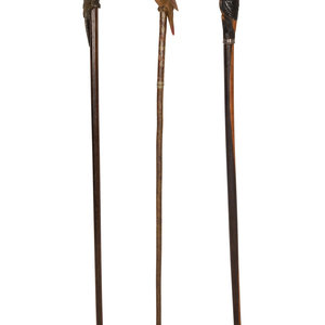 Appraisal: Three Zoomorphic Walking Sticks th th Century each with a