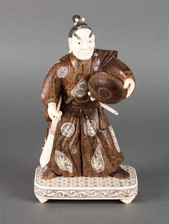 Appraisal: Japanese carved wood and ivory figure of a warrior th