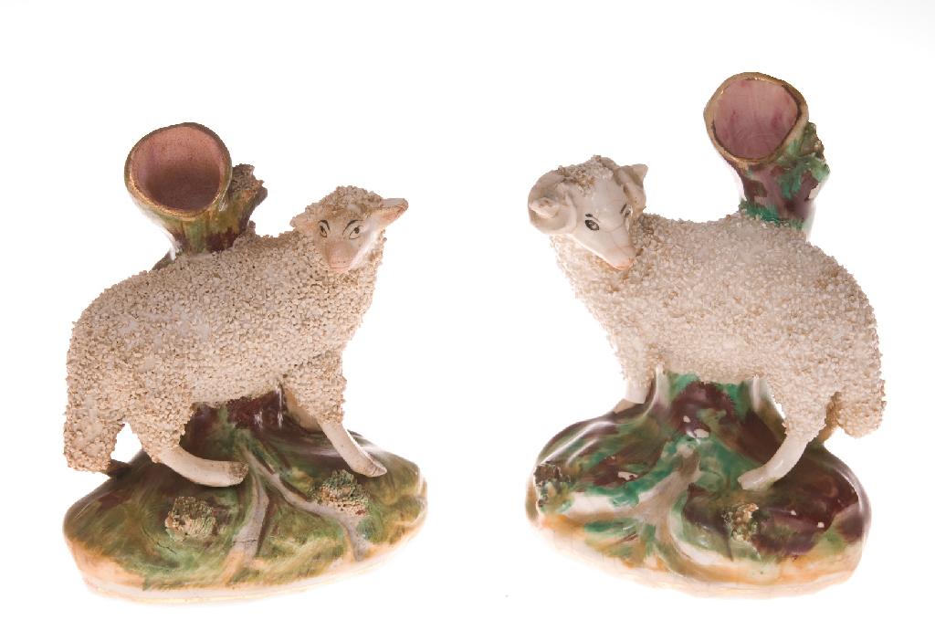 Appraisal: ASSEMBLED PAIR OF STAFFORDSHIRE SHEEP SPILL VASES th CENTURY modelled