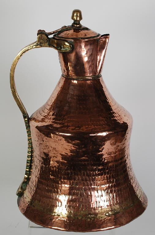 Appraisal: EASTERN SEAMED COPPER AND BRASS WINE JUG churn shaped with