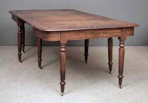 Appraisal: A George III mahogany dining table the top with moulded