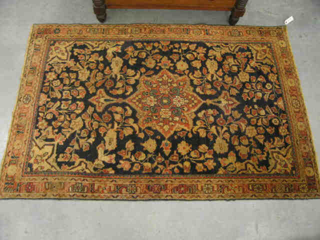 Appraisal: Mahal Persian Handmade Rug floral on indigo field earthtone trim