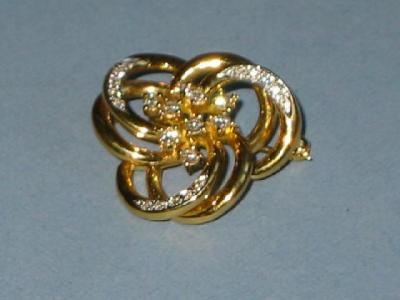 Appraisal: A GOLD BROOCH formed into six interlocking circles set with