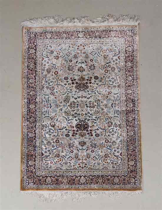 Appraisal: A Persian Silk Rug having a center medallion within triple