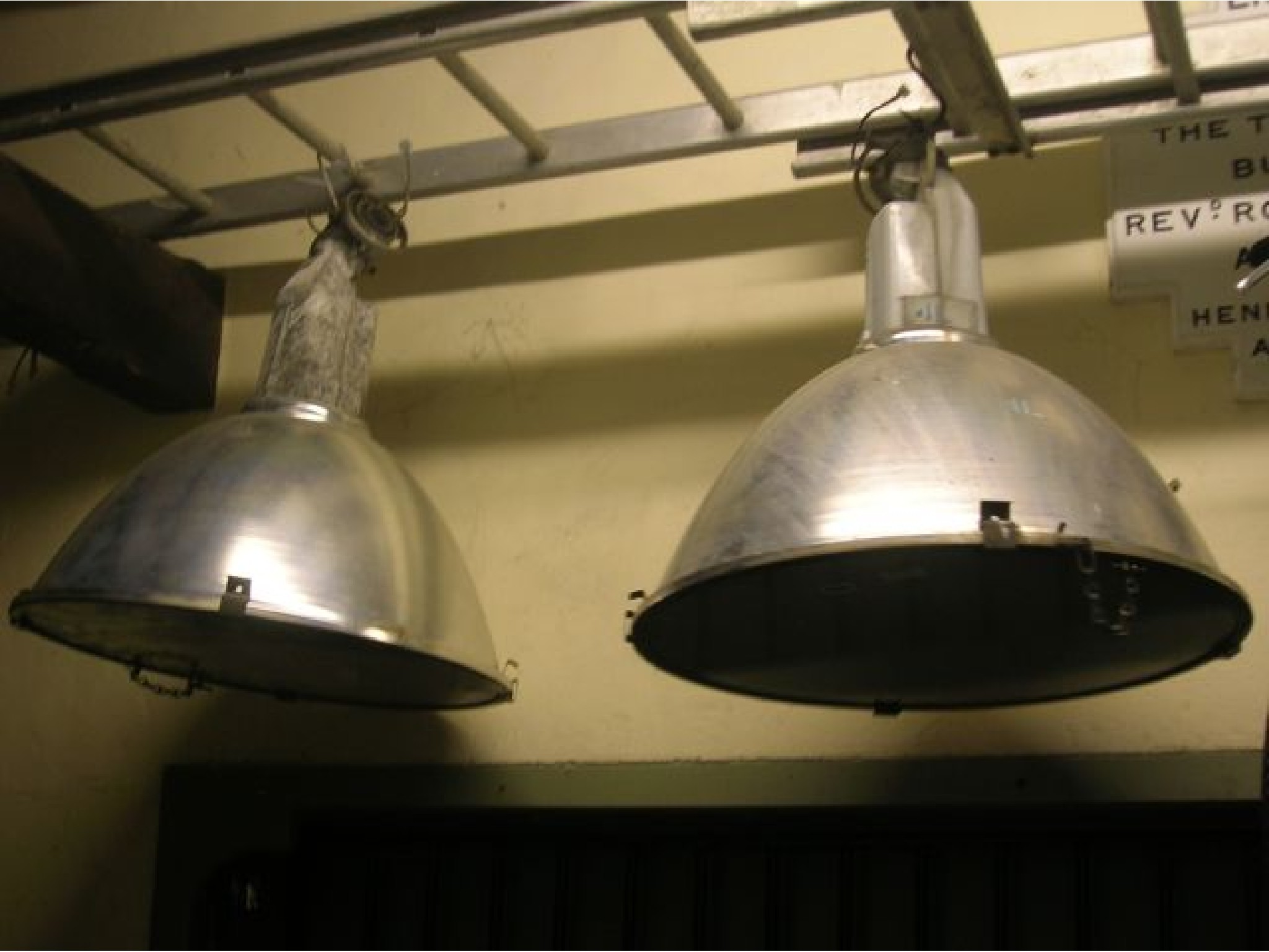 Appraisal: A pair of contemporary industrial hanging ceiling lights with domed