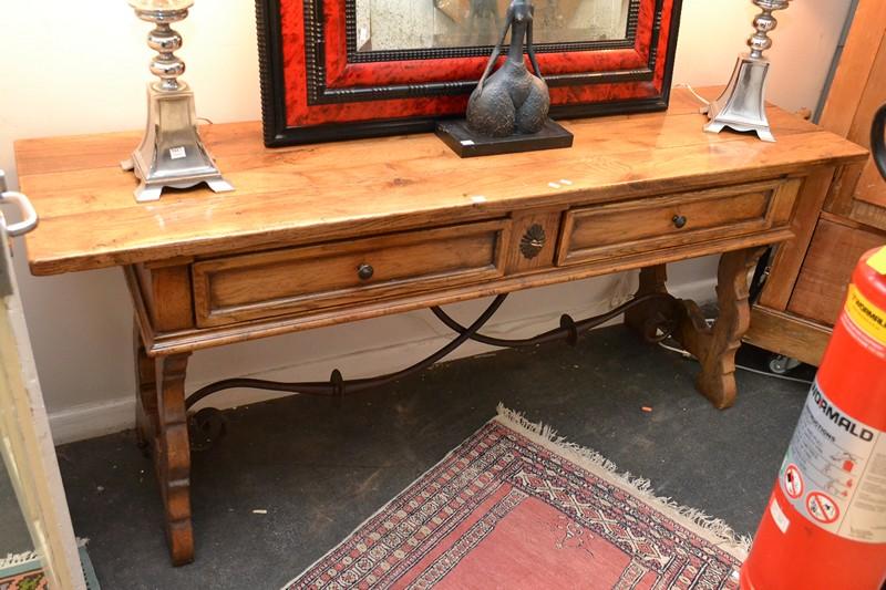 Appraisal: A SPANISH PROVINICAL STYLE OAK HALL TABLE WITH TWO DRAWERS