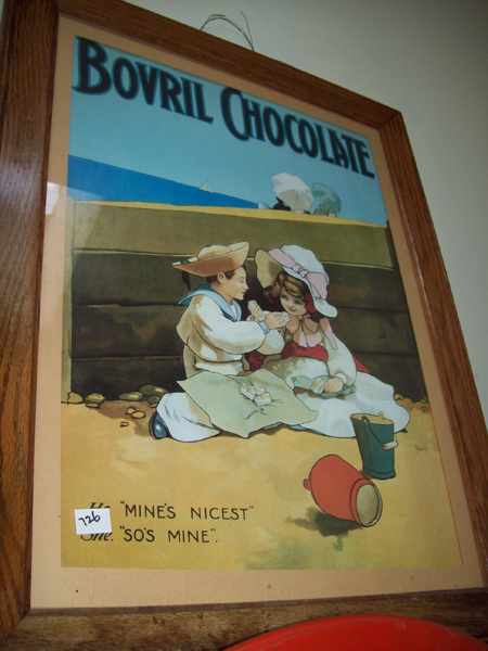 Appraisal: TWO FRAMED PRINTS AND A 'BOVRIL CHOCOLATE' POSTER