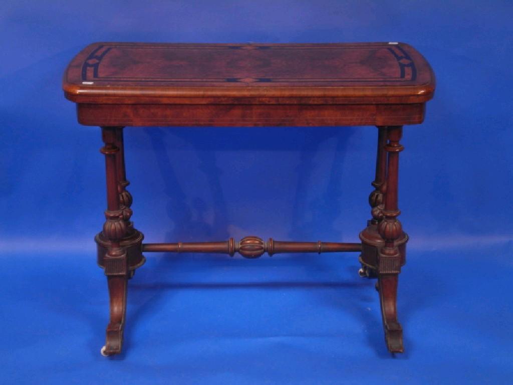 Appraisal: A Victorian burr walnut and inlaid fold-over card table raised