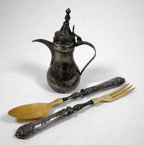 Appraisal: An Eastern silvery metal bulbous coffee pot engraved throughout with