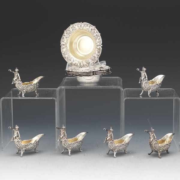 Appraisal: SIX ANTIQUE STERLING SILVER BAROQUE STYLE PUTTO SALT CELLARS AND