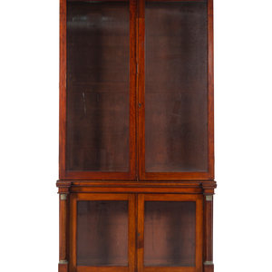 Appraisal: An Empire Style Walnut Bookcase Late th Early th Century