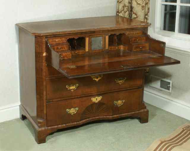 Appraisal: AN EARLY TH CENTURY WALNUT SECRETAIRE CHEST the crossbanded top