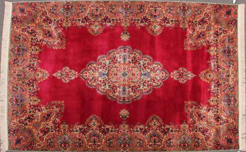 Appraisal: Karastan Medallion Kirmanred field with central lozenge and floral border