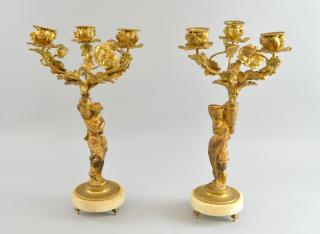 Appraisal: Pair of th century gilt metal three light candelabra figural