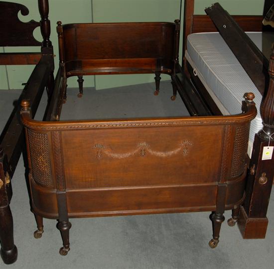 Appraisal: A French Corbeille Single Bed having caned inserts shaped crests