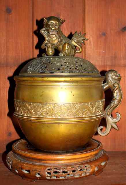 Appraisal: A CHINESE BRONZE CENSER AND COVER with lion dog finial