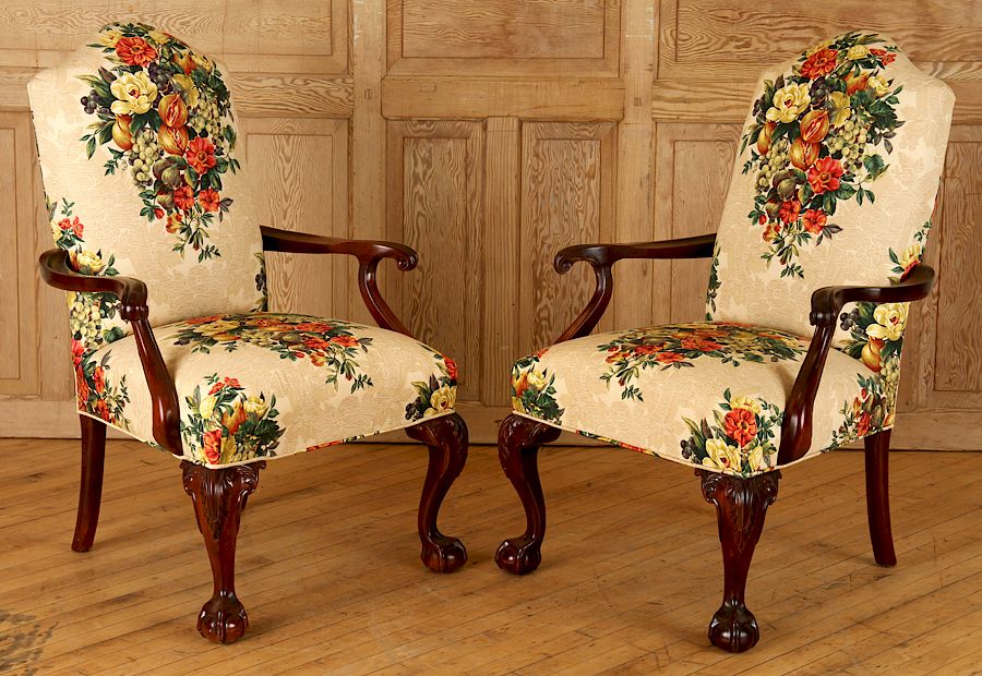 Appraisal: PAIR CHIPPENDALE STYLE UPHOLSTERED ARM CHAIRS A pair of Chippendale