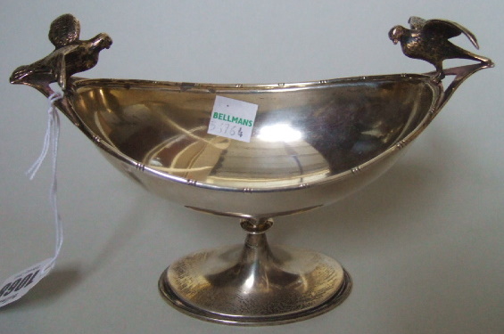 Appraisal: A silver twin handled dish the handles formed as birds