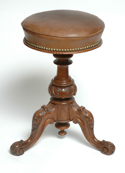 Appraisal: A VICTORIAN WALNUT PIANO STOOL With a circular leather swivel