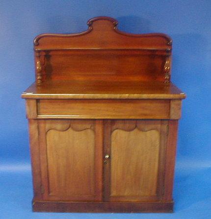 Appraisal: A Victorian mahogany chiffonier with shaped shelf over frieze drawer