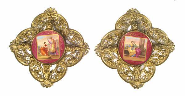 Appraisal: A pair of Vienna style porcelain plates with bronze mounts