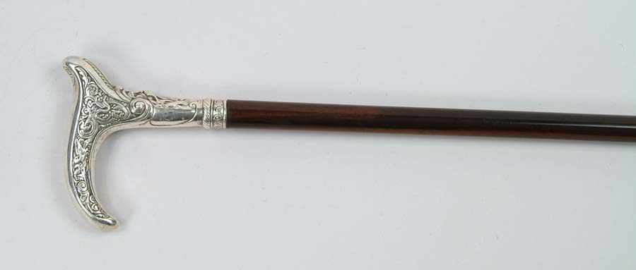 Appraisal: CANE SILVER TOP CANE T-shaped handle is silver having mask