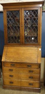 Appraisal: Secretary desk Secretary desk executed in quartersawn oak having a