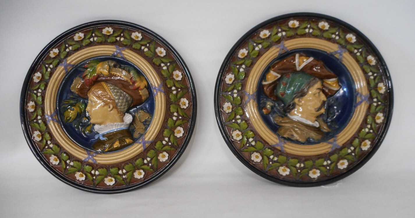 Appraisal: PAIR GERMAN MAJOLICA WALL PLAQUES th c each depicting a