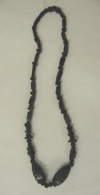 Appraisal: A JET NECKLACE having four graduated fancy beads set within