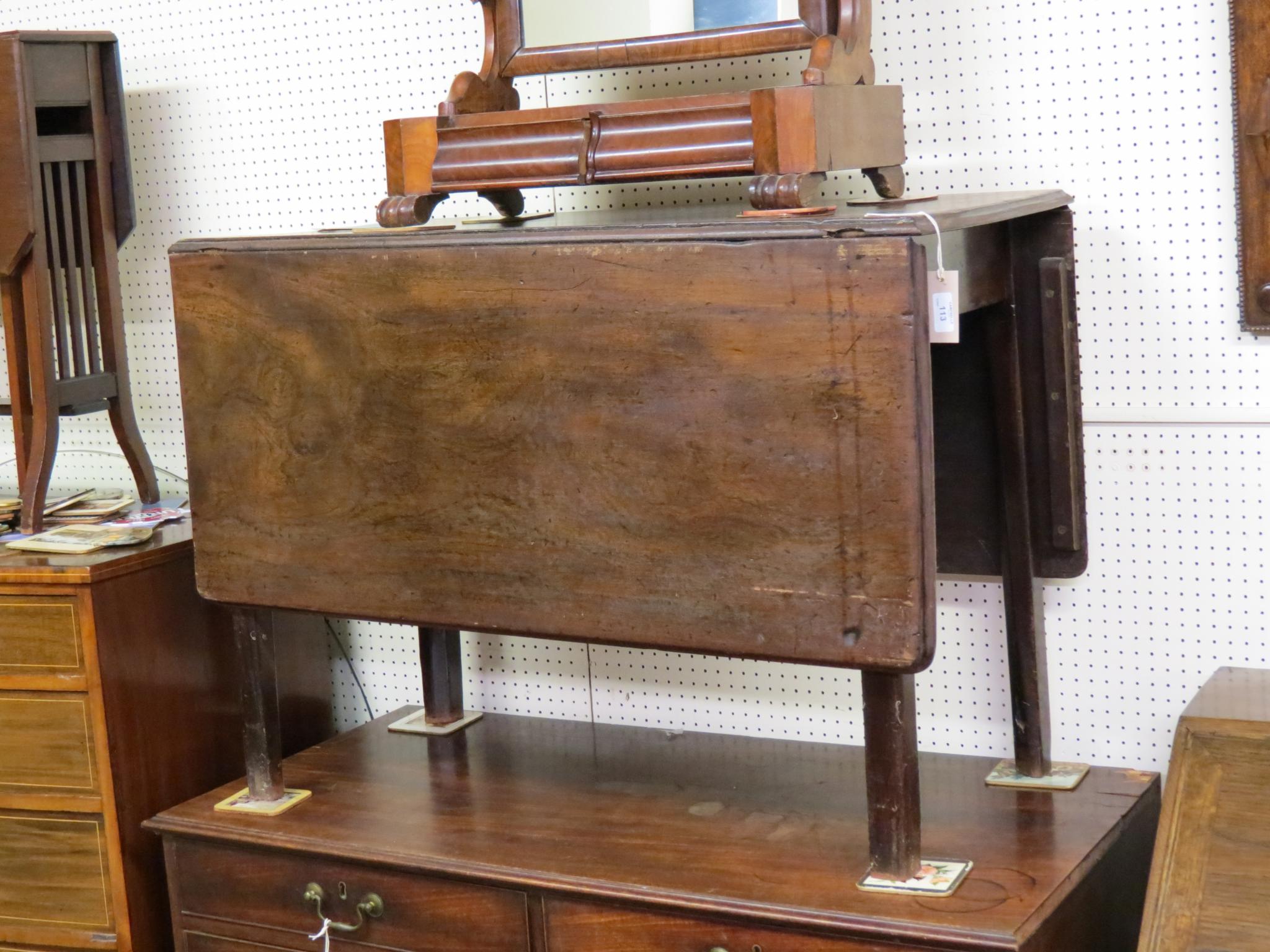 Appraisal: A th century mahogany drop-leaf dining table on plain square