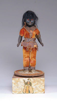 Appraisal: BLACK DOLL ON MUSIC BOX Wooden music box plays Blue