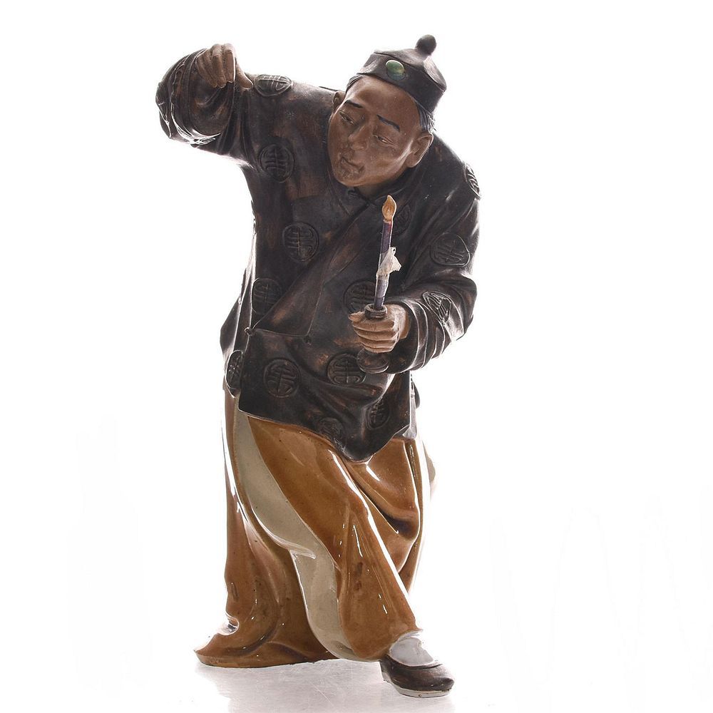 Appraisal: CHINESE CERAMIC FIGURINE MAN WITH CANDLE Asian man in traditional