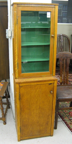 Appraisal: AN OAK CABINET ON MUSIC CABINET American c The top