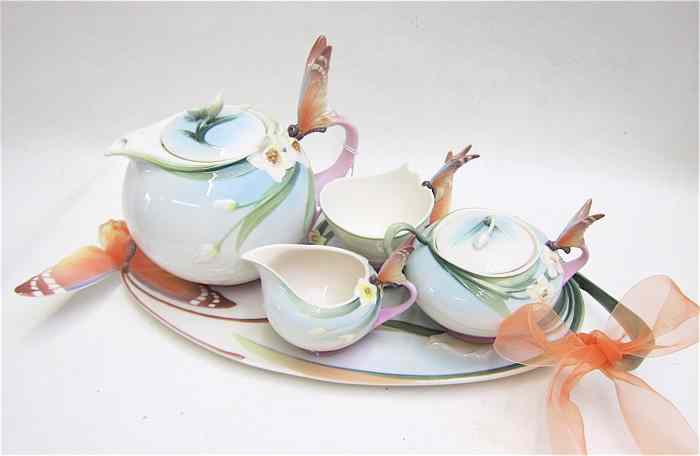 Appraisal: CHINESE POTTERY TEA SET by Franz influenced by the Art