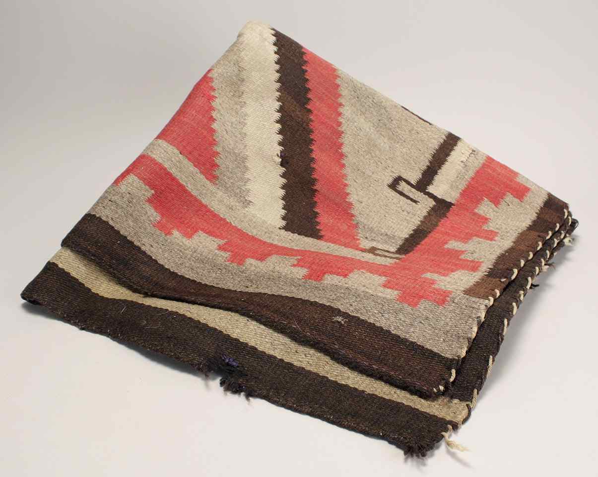 Appraisal: NAVAJO RUGCirca Possibly Ganado Chevron design in red grey brown