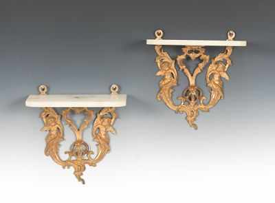 Appraisal: A Pair of Rococo Style Wall Brackets Rococo style cast