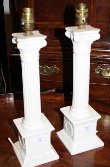 Appraisal: A PAIR OF WHITE GLAZED TABLE LAMPS of corinthian column