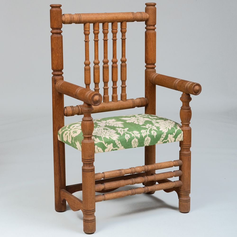 Appraisal: Large Continental Carved Oak Armchair Fitted with a linen upholstered