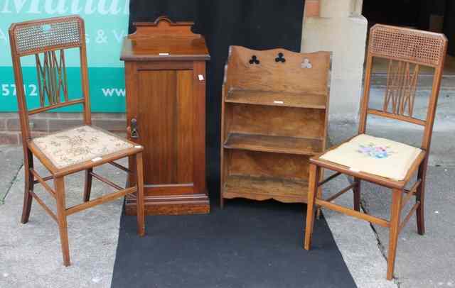 Appraisal: AN EDWARDIAN WALNUT POT CUPBOARD enclosed by a single panel