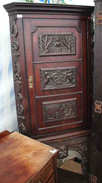 Appraisal: AN ANTIQUE OAK CORNER CUPBOARD ON STAND with carved panels