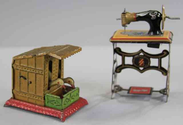 Appraisal: SEWING MACHINE AND GEESE PENNY TOYS Both lithographed in tin