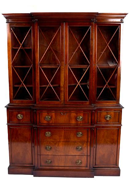 Appraisal: A George III style mahogany secretary bookcase by Saginaw Furniture