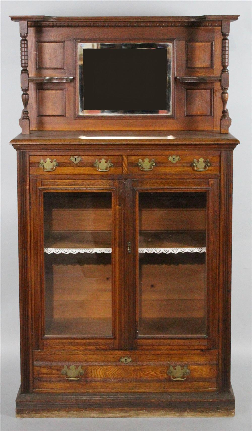 Appraisal: EASTLAKE STYLE OAK GLAZED BOOKCASE circa the shaped rectangular paneled