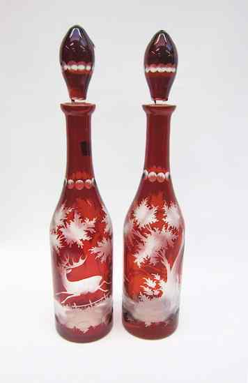 Appraisal: PAIR BOHEMIAN GLASS DECANTERS cut and etched red to clear